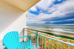 A balcony with a view of the beach and ocean. - Bay Watch Resort 0604 (North Myrtle Beach)