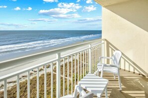 A balcony with a view of the beach and ocean. - Bay Watch Resort 0906 (North Myrtle Beach)