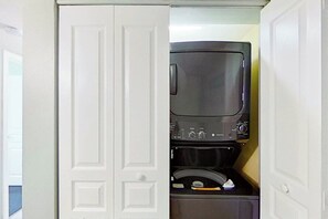 A white wardrobe with a microwave and a small appliance inside. - Bay Watch Resort 1002 (North Myrtle Beach)