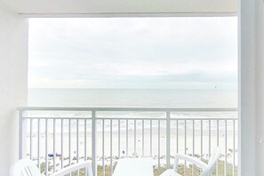 A balcony with a view of the beach and ocean. - Bay Watch Resort 1139 Oceanfront (North Myrtle Beach)