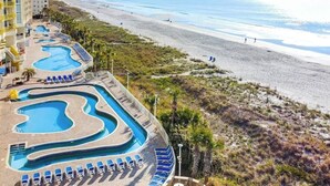 A resort with a swimming pool, beach access, and a view of the ocean. - Bay Watch Resort 1603 (North Myrtle Beach)