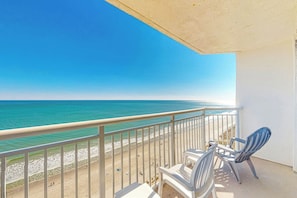 A balcony with a view of the beach and ocean. - Bay Watch Resort 1809 (North Myrtle Beach)