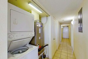 A laundry room with a washing machine, dryer, and utility room. - Bay Watch Resort 1815 (North Myrtle Beach)