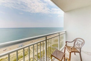 A balcony with a view of the beach and ocean. - Camelot by the Sea 1103 (Myrtle Beach)