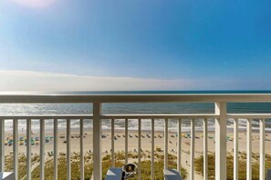 A balcony with a view of a beach, including the ocean and sandy shore. - Camelot by the Sea 1216 (Myrtle Beach)