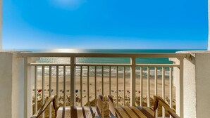 A balcony with a view of a beach and ocean. - Camelot by the Sea 1704 (Myrtle Beach)