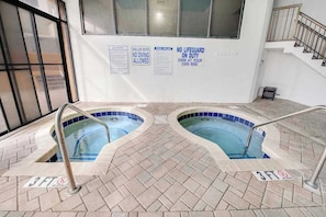 An indoor swimming pool area with two pools, safety signs, and a 3-foot depth marker. - The Patricia Grand 1002 (Myrtle Beach)