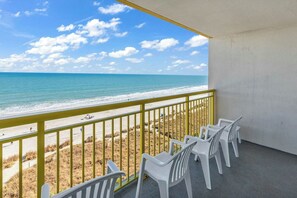 A balcony with a view of the beach and ocean. - Bay Watch Resort 0715 (North Myrtle Beach)