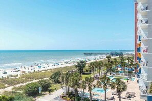 A resort with a pool, beach, and ocean view. - Lighthouse Corner Getaway (Myrtle Beach)