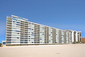 A multi-story hotel with balconies, located near a beach. - Sands Beach Club 1015 - Bright Shores (Myrtle Beach)