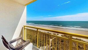 A balcony with a view of the beach and ocean. - Bay Watch Resort 0617 (North Myrtle Beach)