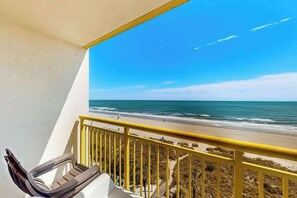A balcony with a view of the beach and ocean. - Bay Watch Resort 0617 (North Myrtle Beach)