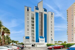 A multi-story hotel with a prominent blue and white facade, labeled 'Crescent Towers.' - Crescent Towers I - 102 (North Myrtle Beach)