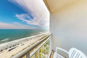 A balcony with a view of a beach and ocean. - Bay Watch Resort 1538 (North Myrtle Beach)