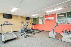 A fitness room with treadmills, elliptical machines, and a stationary bike. - Bahama Sands Unit 0508 (North Myrtle Beach)