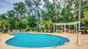 A swimming pool with lounge chairs and a gazebo, surrounded by trees. - *1001 World Tour 206 (Myrtle Beach)