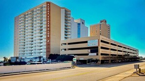 A multi-story parking garage with a sign for 'Sanps Ocean Club.' - Sands Ocean Club 1101 Fruit Cakes (Myrtle Beach)