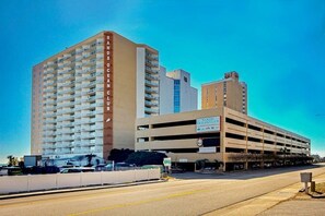 A multi-story parking garage with a sign for 'Sanps Ocean Club.' - Sands Ocean Club 1101 Fruit Cakes (Myrtle Beach)