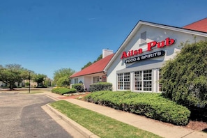 A building with a sign that reads 'A1ssa Pub FOOD & SPIRITS' on the front. - Homey Beach Hideaway C (Myrtle Beach)