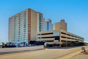 A multi-story hotel with a parking garage and a sign indicating 'SAND'S OCEAN CLUB.' - Sands Ocean Club 1629 (Myrtle Beach)