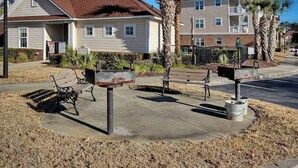 A residential building with a front porch, a mailbox, and a bench. - Cypress Bend Unit 434 (North Myrtle Beach)