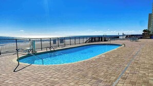 A swimming pool with a view of the beach and ocean. - Royal Gardens Beach Front Condominium (Murrells Inlet)