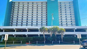 A hotel with a large, multi-story structure and a prominent sign reading 'Royal Garden.' - Royal Gardens Beach Front Condominium (Murrells Inlet)