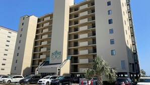 A multi-story hotel with a central entrance and balconies on each floor. - The Summit Unit 2-A Condo (North Myrtle Beach)