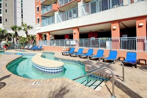 A swimming pool with blue chairs and a no diving sign. - Sandy Daydreams, Unit PH3 (Myrtle Beach)
