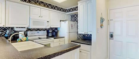 Coffee/tea maker, fridge, microwave, oven