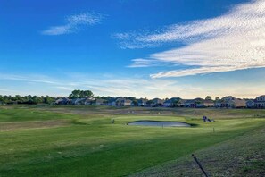 A golf course with a putting green, sand bunker, and a pond. - Double Eagle Unit 5119 (North Myrtle Beach)