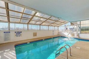 An indoor swimming pool with clear pool rules and no lifeguard on duty. - Sea Marsh II Unit 1002 (North Myrtle Beach)