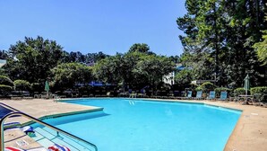 A swimming pool with lounge chairs and a clear sky. - River Crossing Unit 131 (North Myrtle Beach)
