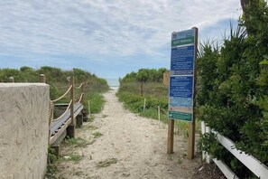 A beach path with a sign indicating the 4207 Walkway. - Endless Summer Oasis (North Myrtle Beach)