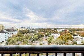 A cityscape with buildings, trees, and a clear sky. - Holiday Towers Unit 1001 (Myrtle Beach)