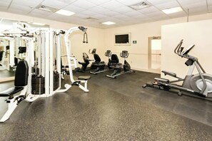 A gym with various exercise equipment including treadmills, elliptical machines, and weight machines. - Renaissance Tower 1114 (Myrtle Beach)