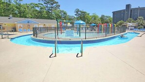 A swimming pool with a fenced play area and lounge chairs. - Renaissance Tower 1114 (Myrtle Beach)