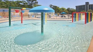 A water play area with a central fountain and surrounding play structures. - Renaissance Tower 816C (Myrtle Beach)