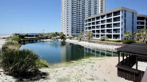 A hotel with multiple floors, a pool, and a beach area. - Renaissance Tower 816C (Myrtle Beach)