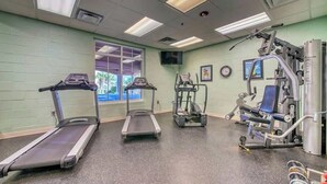 A gym with treadmills, a stair climber, and weight machines. - Tilghman Beach and Golf 1519 (North Myrtle Beach)