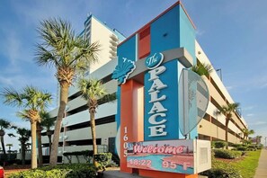A hotel sign with 'The Palace' and a welcome message, including the time and temperature. - Palace Resort Unit 1604 (Myrtle Beach)