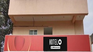A hotel building with a prominent 'HOTEL' sign on the facade. - Hotel O Doddabalapura (Doddaballapur)
