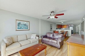 A living room with a sofa, a coffee table, and a ceiling fan. - Bahama Sands Unit 0903 (North Myrtle Beach)