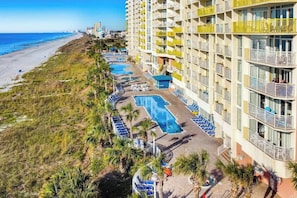 A hotel with multiple swimming pools, a beach, and a coastal view. - Bay Watch Resort 0339 (North Myrtle Beach)