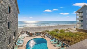 A pool area with a view of the beach and ocean. - Serenity Now Retreat (Murrells Inlet)