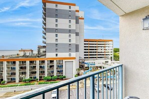 A multi-story hotel with a parking garage and a swimming pool area. - Sand Dunes Resort 2647/2648 (Myrtle Beach)