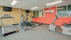 A fitness room with treadmills, ellipticals, and a stationary bike. - Bahama Sands Unit 0502 (North Myrtle Beach)