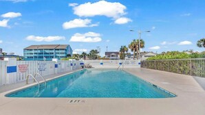 A swimming pool with a lifeguard tower, a no lifeguard warning sign, and a 5 ft depth marker. - Crescent Towers I - 304 (North Myrtle Beach)