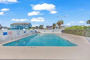 A swimming pool with a lifeguard tower, a no lifeguard warning sign, and a 5 ft depth marker. - Crescent Towers I - 304 (North Myrtle Beach)