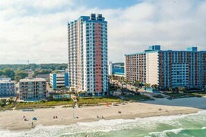 A coastal hotel with multiple high-rise buildings, a beach, and ocean views. - Palace Resort Unit 710 (Myrtle Beach)